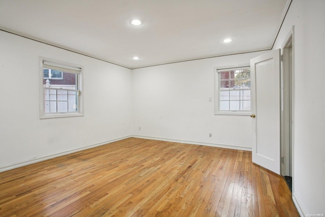 unfurnished room featuring light hardwood / wood-style flooring