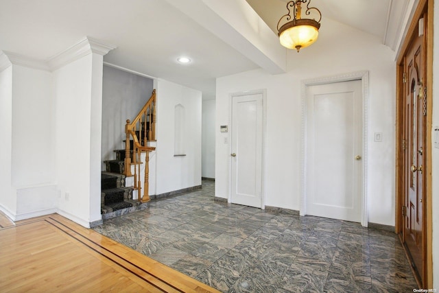 entryway featuring dark hardwood / wood-style flooring and ornamental molding