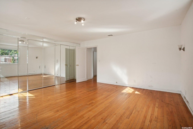 unfurnished bedroom with light hardwood / wood-style floors