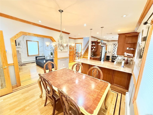 dining room with a baseboard radiator, light wood-style flooring, recessed lighting, stairway, and crown molding