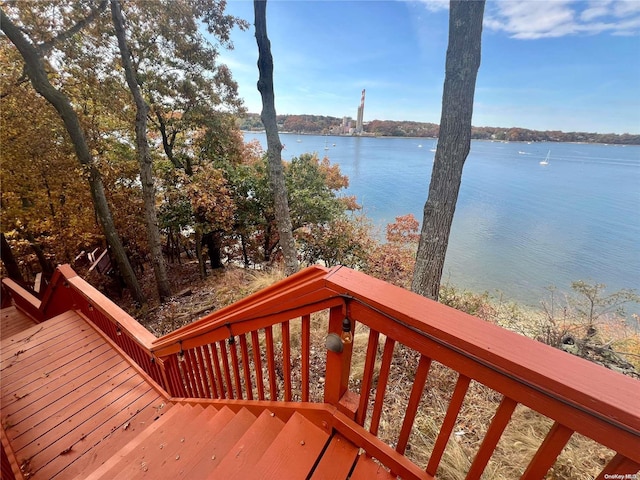 wooden terrace with a water view