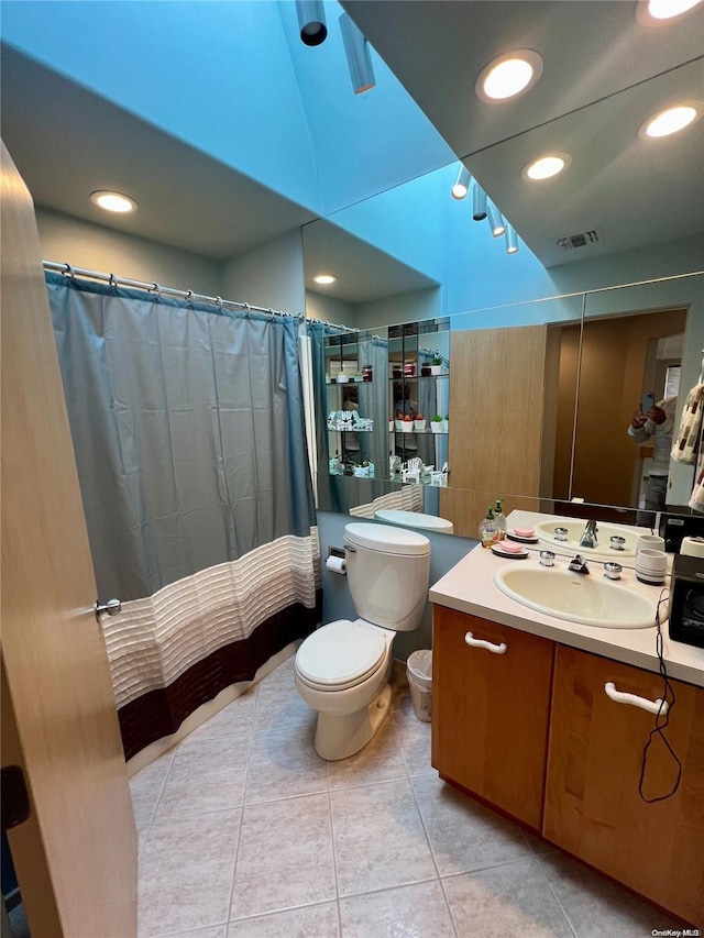 bathroom with recessed lighting, visible vents, toilet, vanity, and tile patterned flooring