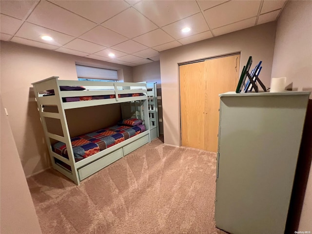 bedroom featuring carpet, a drop ceiling, and recessed lighting