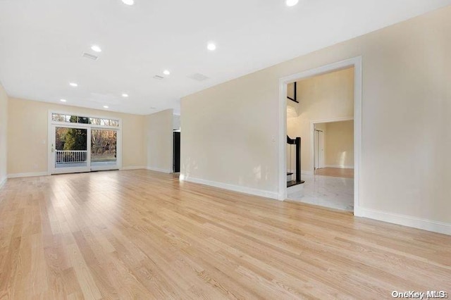 unfurnished living room with light wood-type flooring