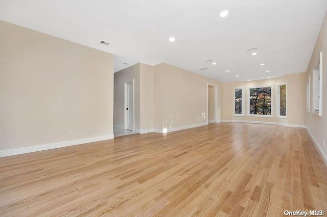 unfurnished living room with light wood-type flooring