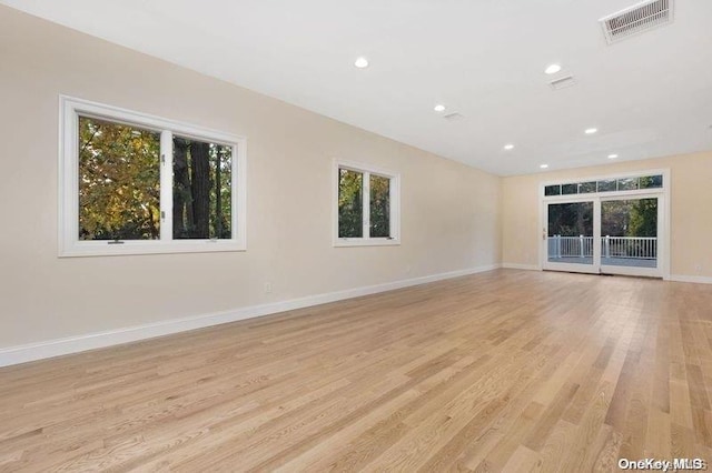 unfurnished living room with light wood-type flooring