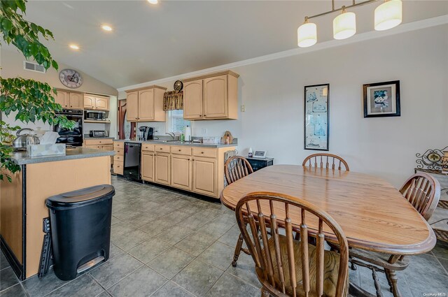 kitchen with crown molding, black appliances, light brown cabinets, pendant lighting, and lofted ceiling