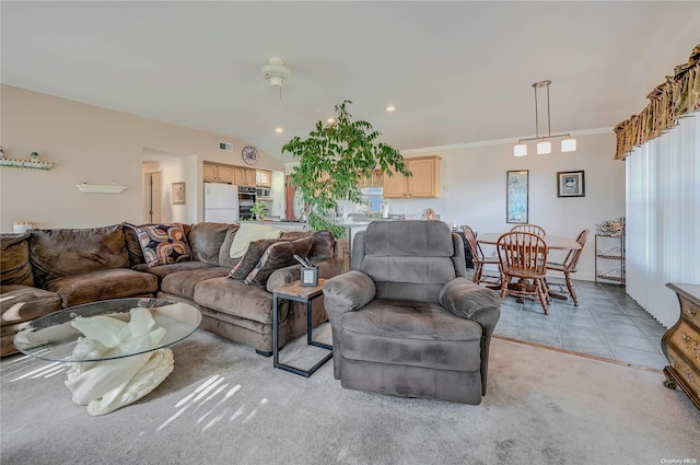 living room featuring light tile patterned flooring, vaulted ceiling, and ornamental molding