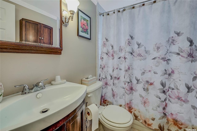 bathroom with a shower with curtain, toilet, ornamental molding, and vanity