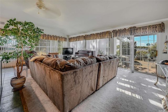 living room with ceiling fan and lofted ceiling