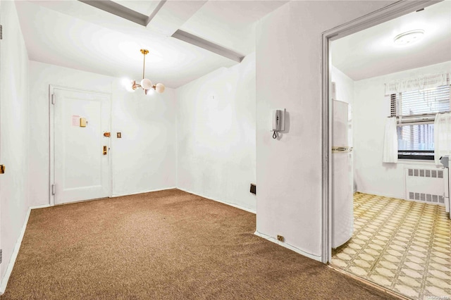 carpeted spare room featuring beamed ceiling, a notable chandelier, and radiator heating unit