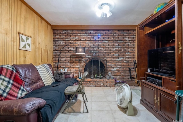 living room featuring a brick fireplace, wooden walls, brick wall, and ornamental molding