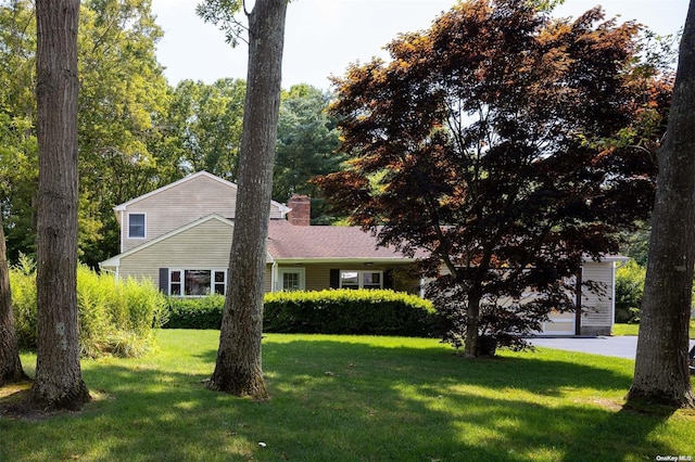 view of side of home featuring a yard