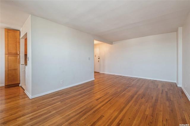 spare room with light hardwood / wood-style floors