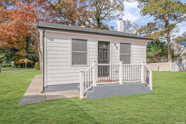 view of outbuilding with a lawn