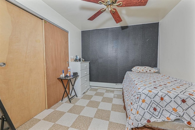 bedroom with ceiling fan and a closet