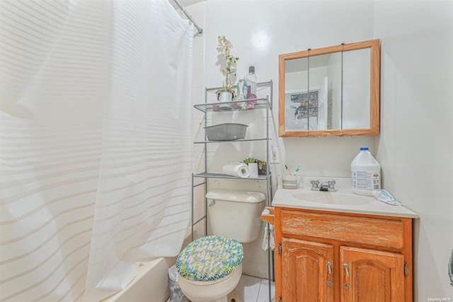 bathroom featuring tile patterned floors, vanity, and toilet