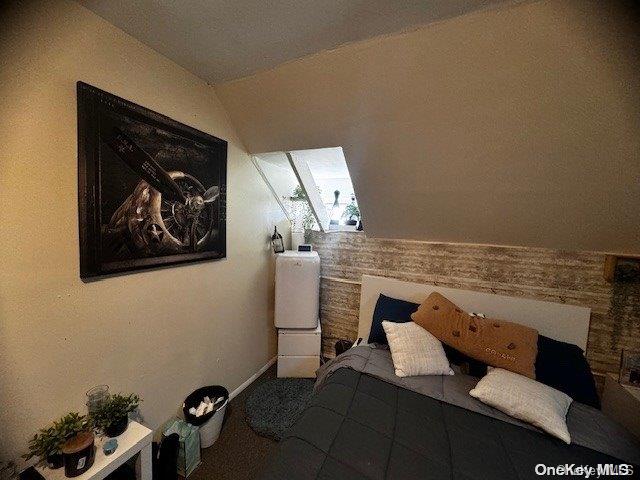 bedroom with vaulted ceiling