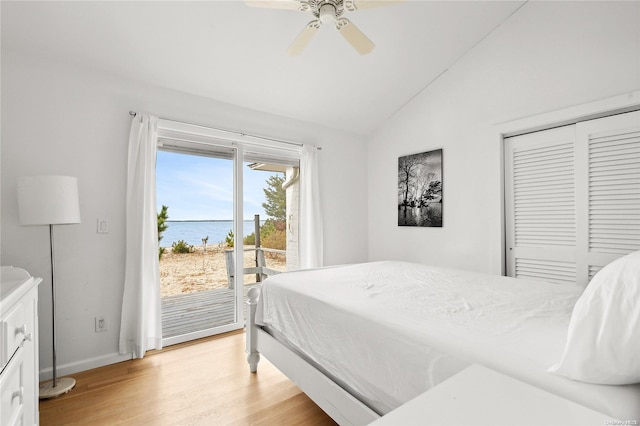 21 E Shore Dr, Southampton, NY 11968 - bedroom featuring ceiling fan, access to outside, a closet, a water view, and light wood-type flooring