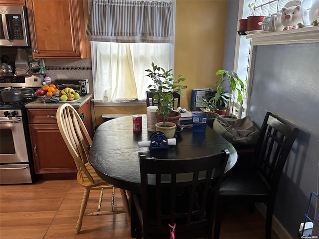 dining area with light wood-type flooring