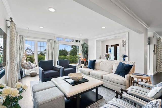 living room featuring crown molding, hardwood / wood-style floors, and french doors