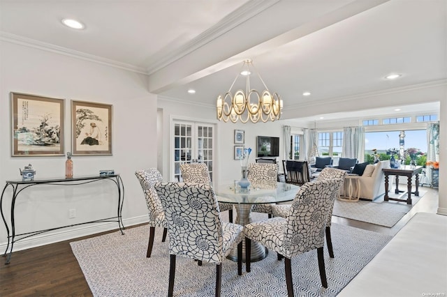 dining area featuring hardwood / wood-style floors, ornamental molding, french doors, and a chandelier