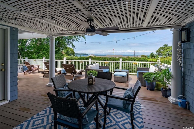 deck featuring ceiling fan and an outdoor hangout area