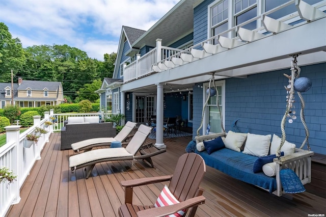 wooden terrace with outdoor lounge area