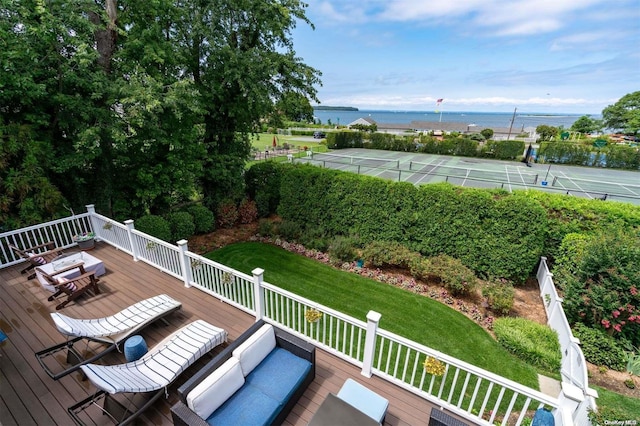 exterior space featuring a yard and a water view