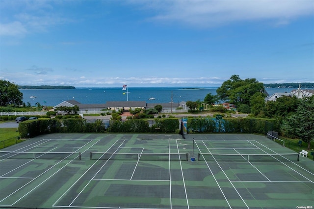 view of sport court featuring a water view