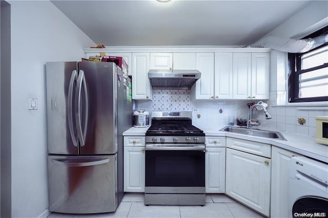 kitchen with sink, stainless steel appliances, ventilation hood, washer / clothes dryer, and white cabinets