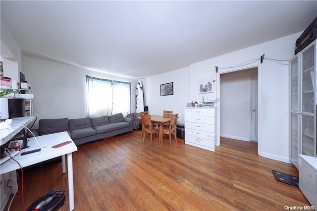 living room with dark hardwood / wood-style floors