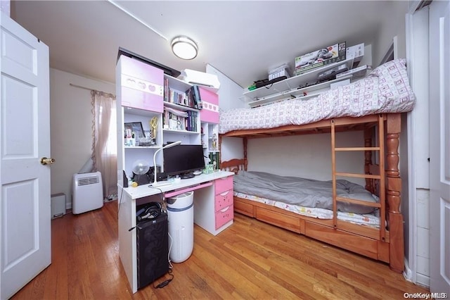 bedroom featuring hardwood / wood-style floors