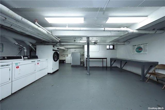 basement with washing machine and dryer and sink