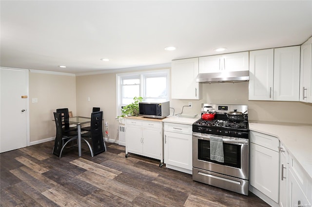 kitchen featuring dark wood-type flooring, white cabinets, and stainless steel appliances