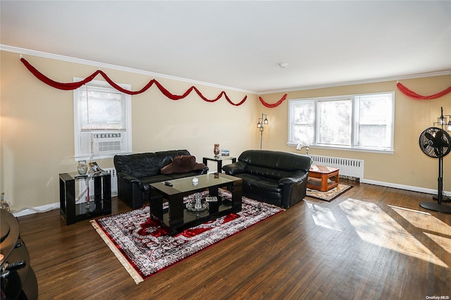 living room with cooling unit, radiator heating unit, dark wood-type flooring, and ornamental molding