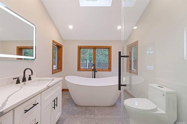 bathroom with a bathing tub, tile patterned flooring, vaulted ceiling, toilet, and vanity