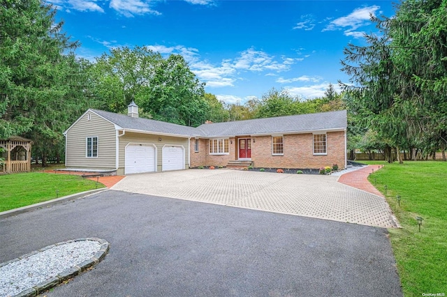 single story home featuring a garage and a front lawn