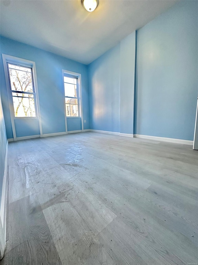 spare room featuring baseboards