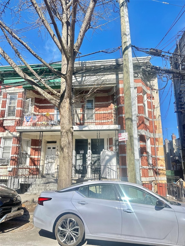 view of front of house featuring brick siding