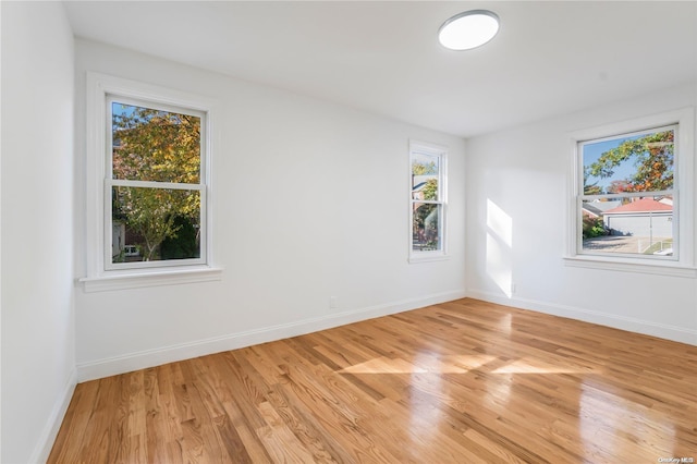 spare room featuring light hardwood / wood-style floors