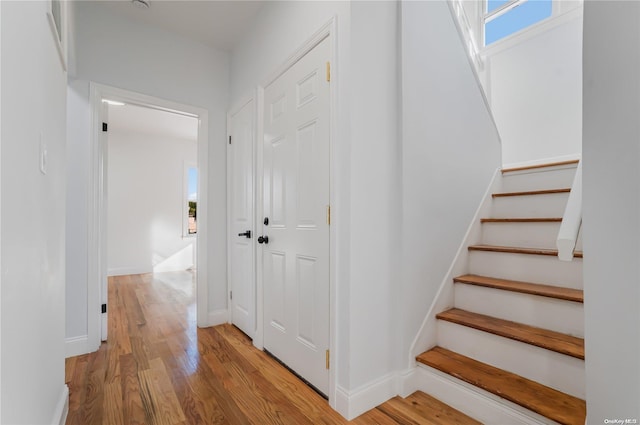 staircase featuring hardwood / wood-style floors