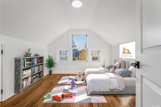 bedroom with dark hardwood / wood-style flooring and lofted ceiling