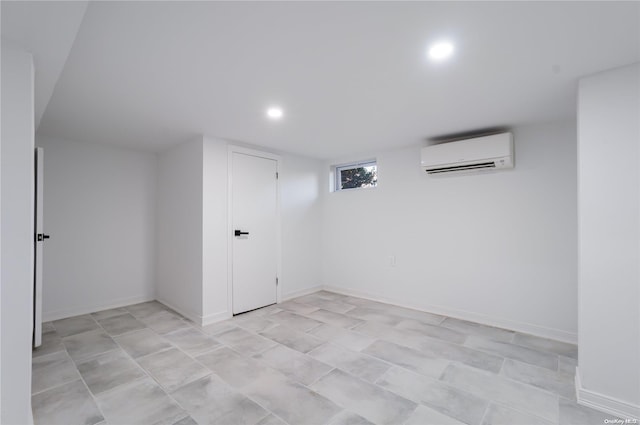 basement featuring a wall mounted air conditioner