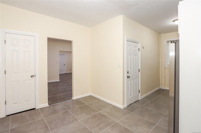 hall with light tile patterned flooring