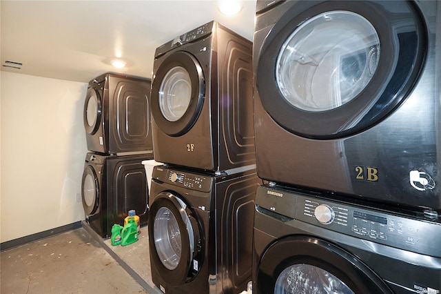 laundry room with stacked washer and dryer