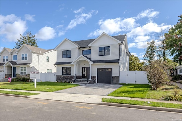 view of front facade with a garage and a front yard