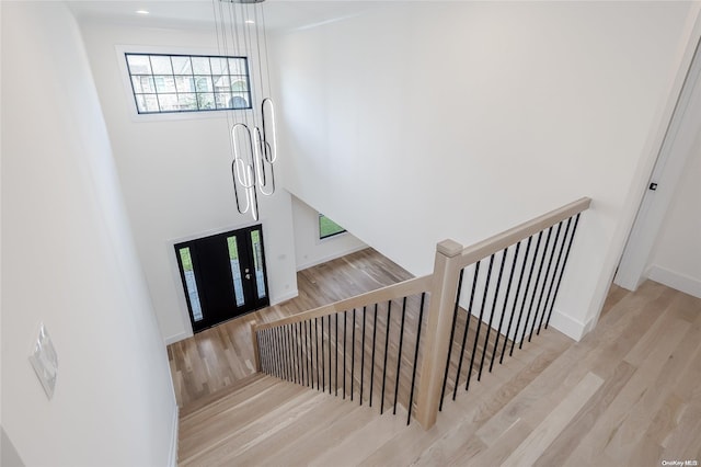 stairway with hardwood / wood-style flooring