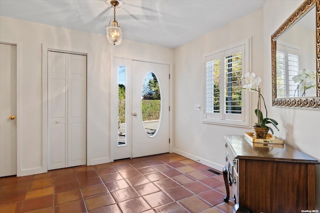 tiled entryway featuring a wealth of natural light