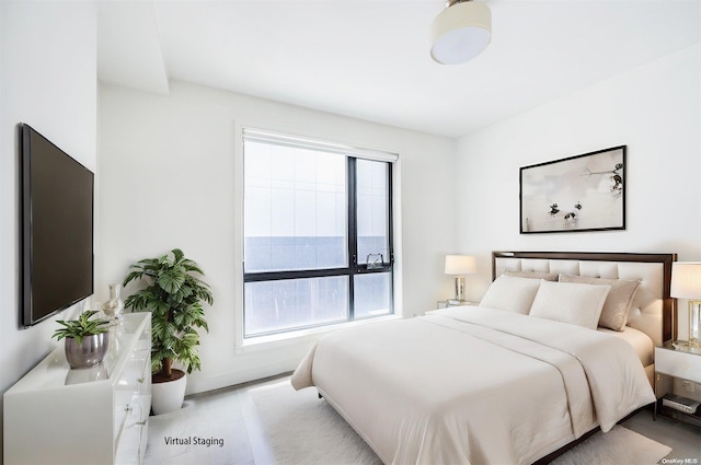 bedroom featuring multiple windows